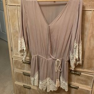 Beautiful jumper with lace trim on sleeves & lower shorts. Smoke & pet free home